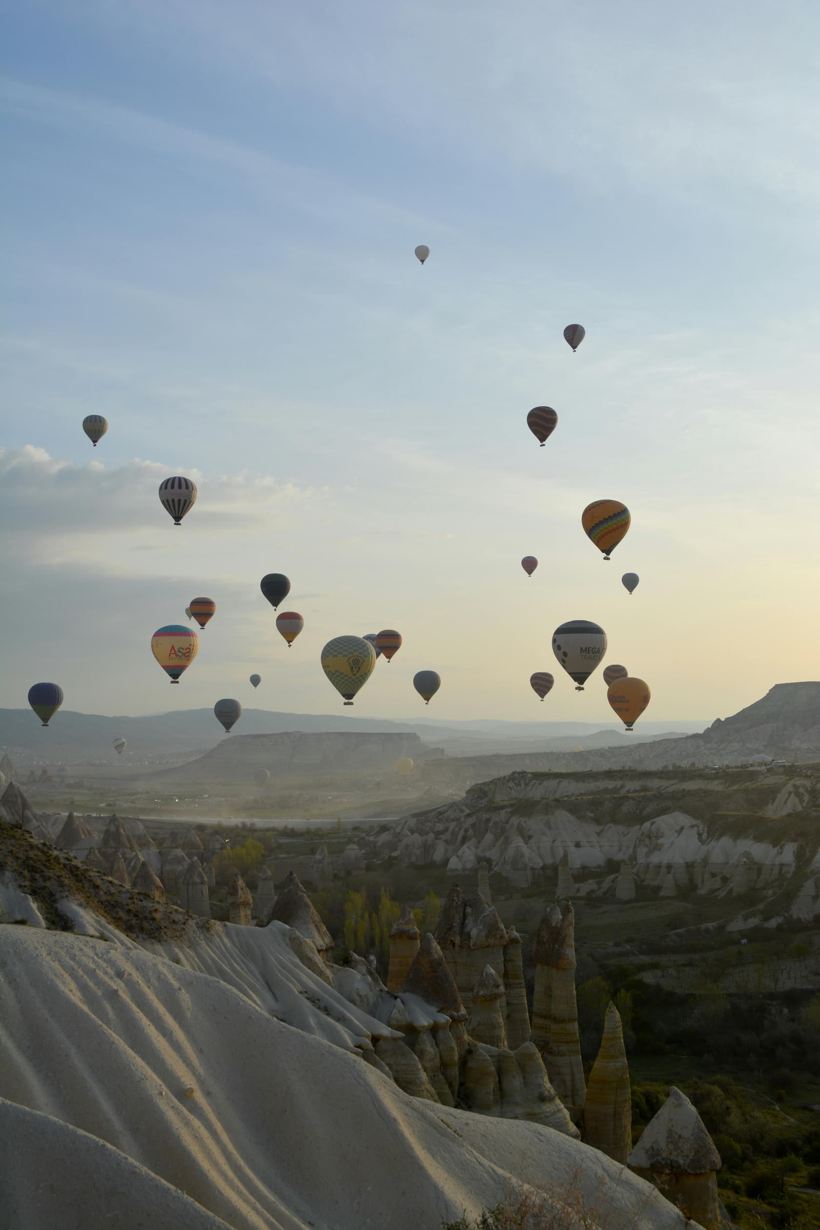 Hot air balloons over Cappadocia at sunrise