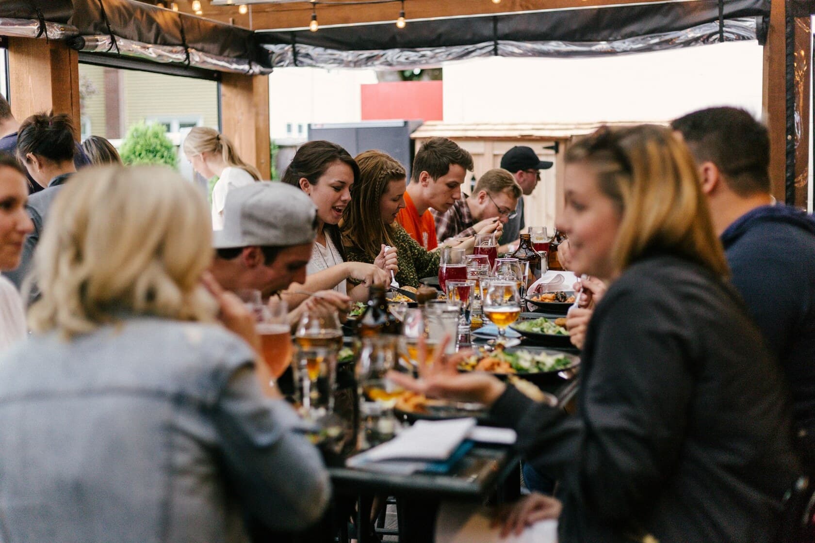 A tour group sharing a table mid-tour